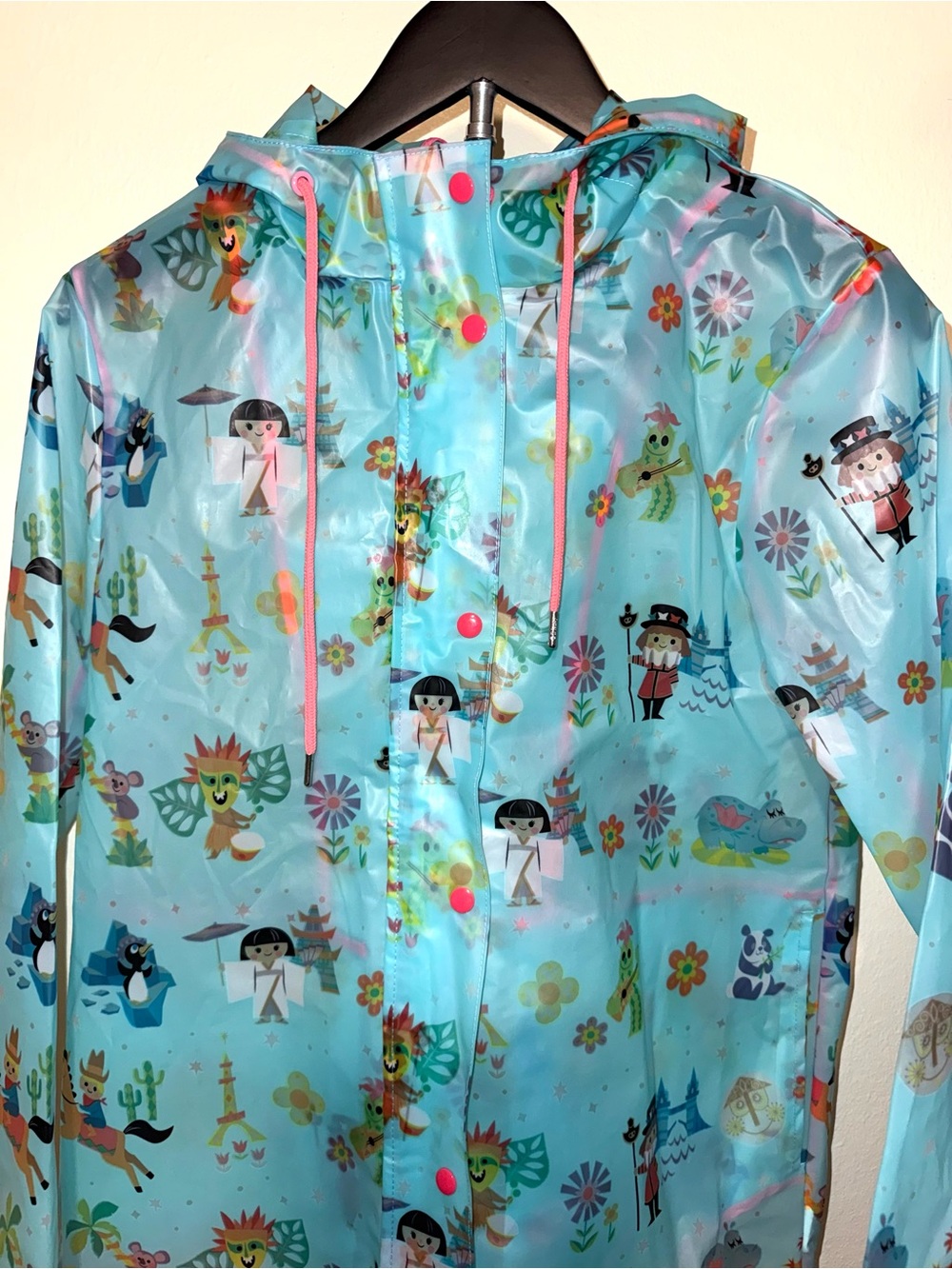 Disney Parks translucent blue “It’s a Small World” Raincoat, size S, EUC - Picture 2 of 6